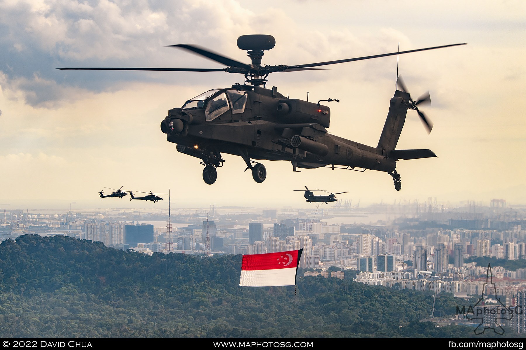 Apache Longbow escort of the western Fly Our Flag Chinook and eastern route formation in the background