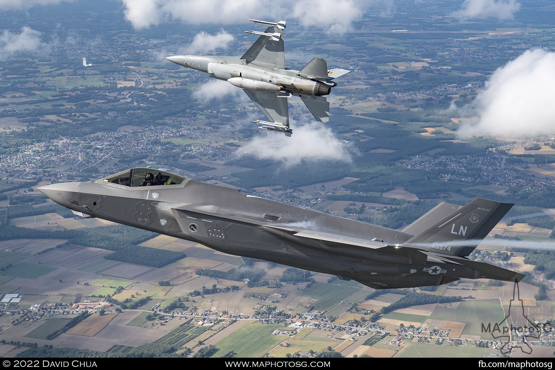 United States Air Force F-35A and Belgium Air Force F-16AM breaking the formation