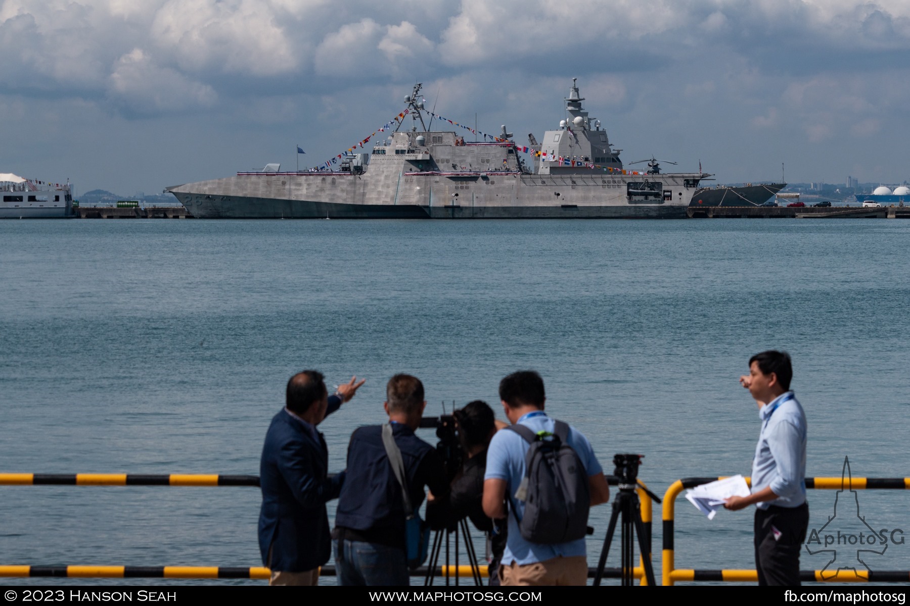 Journalists filming the USS Mobile at the warship display