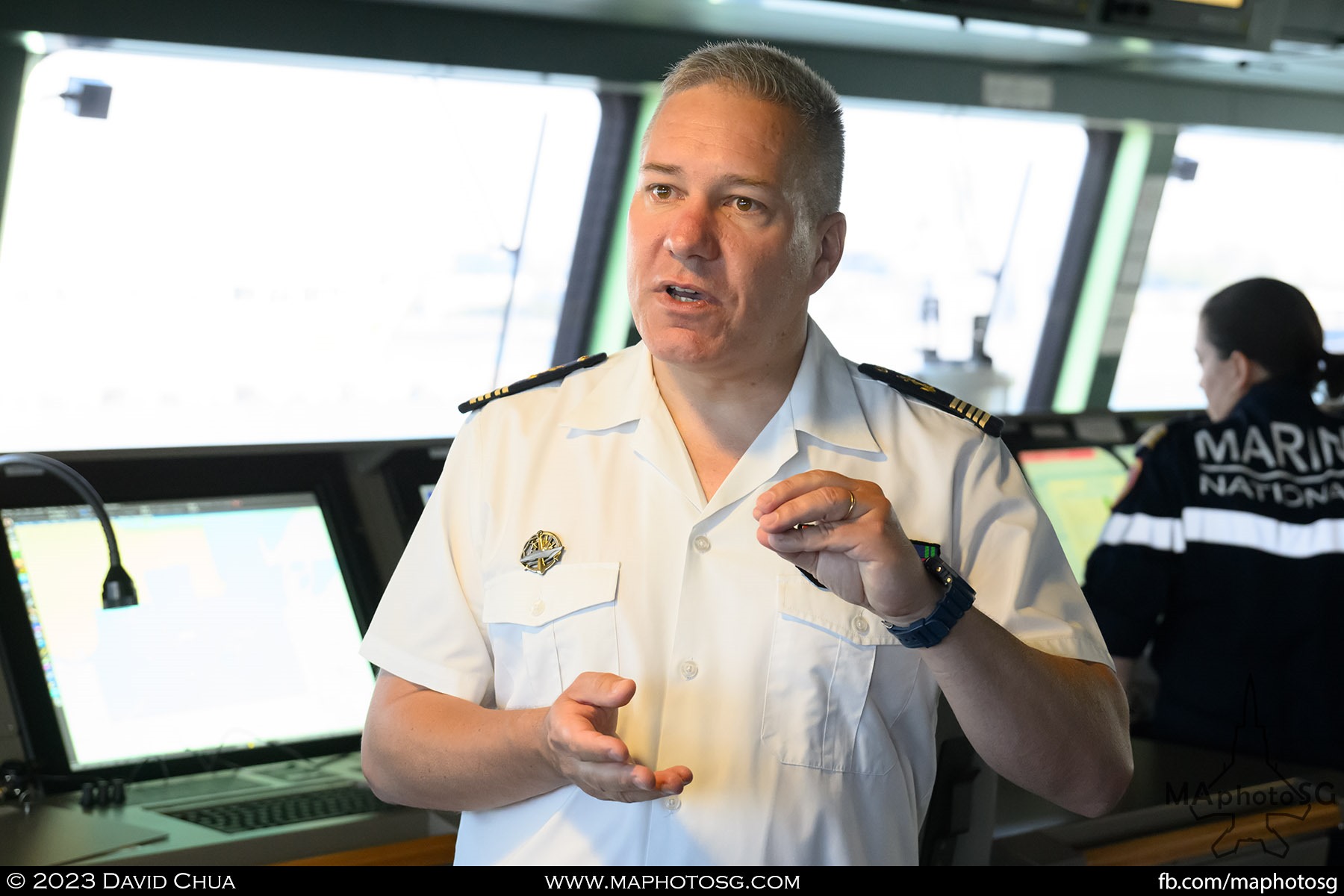 Commander giving a walkthrough of his ship at the bridge