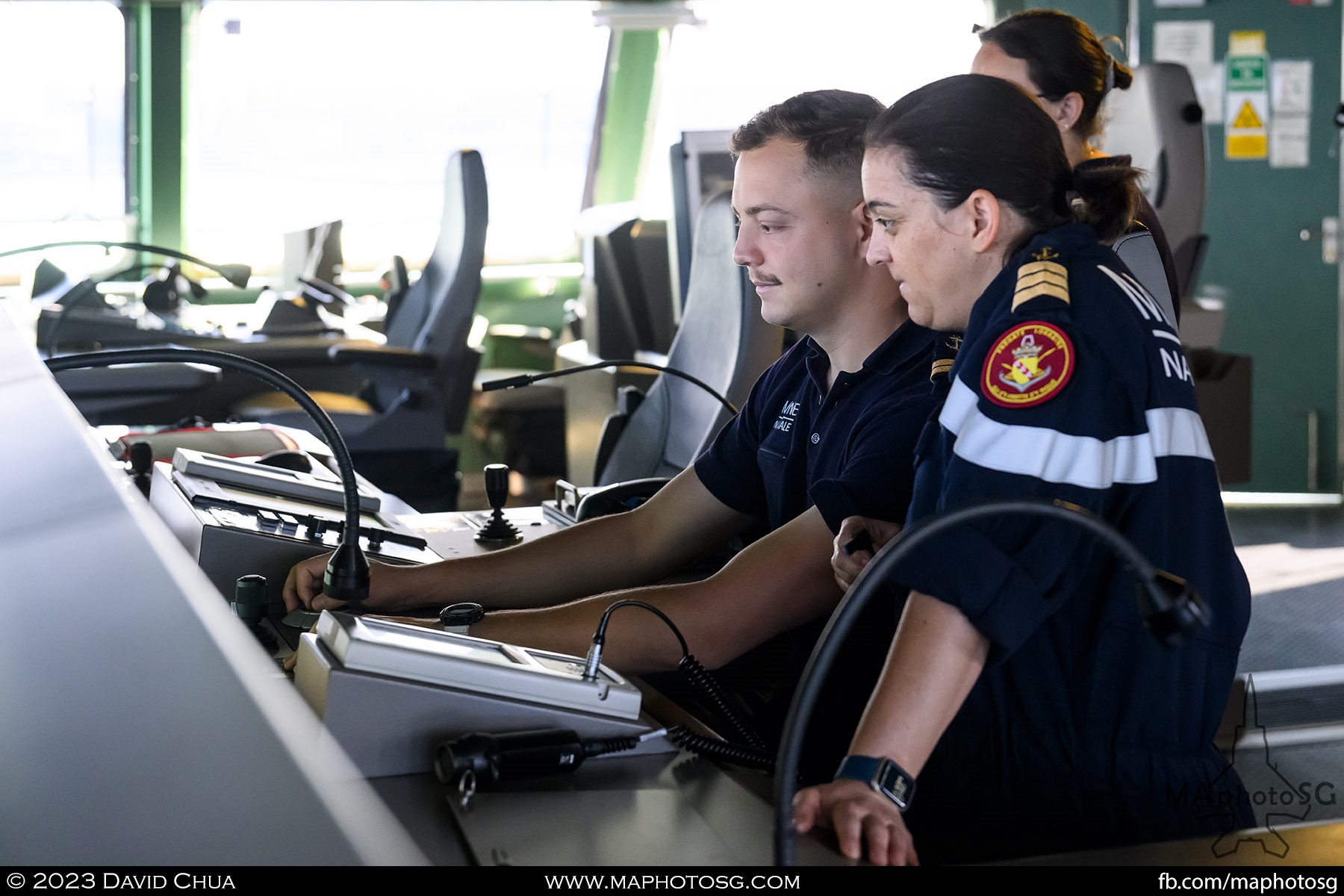 Officers on the bridge of Lorraine monitoring the systems