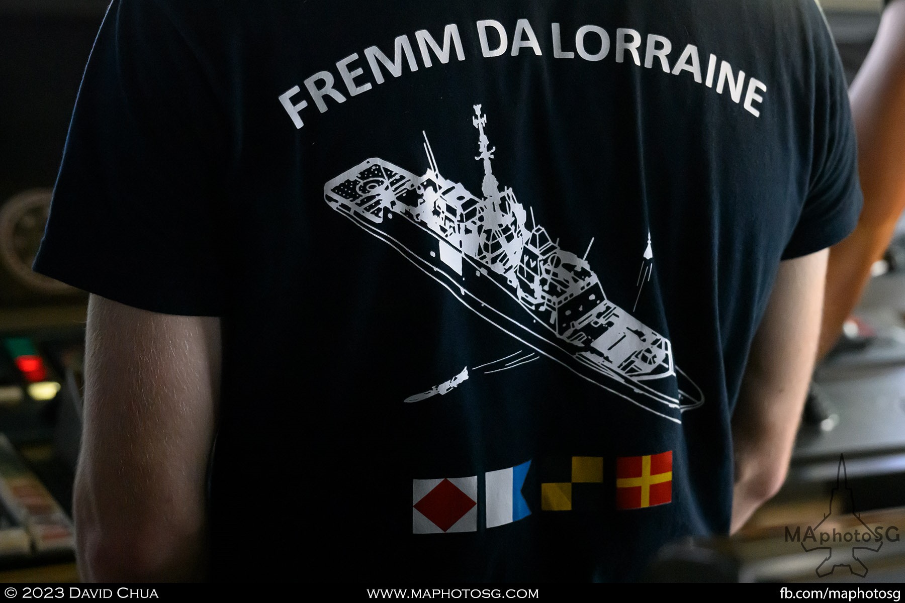A crew member with a Tshirt of the ship