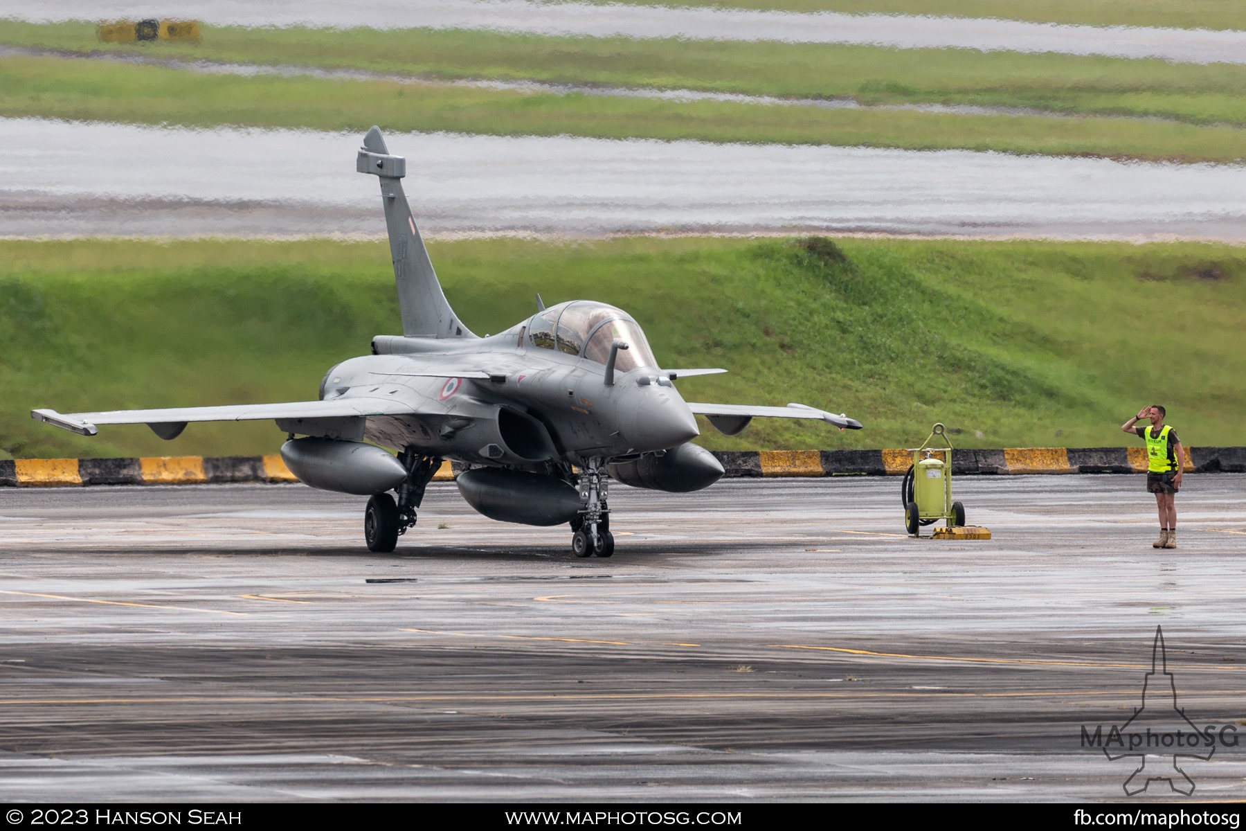 The ground crew salutes the flight crew during the taxi out.