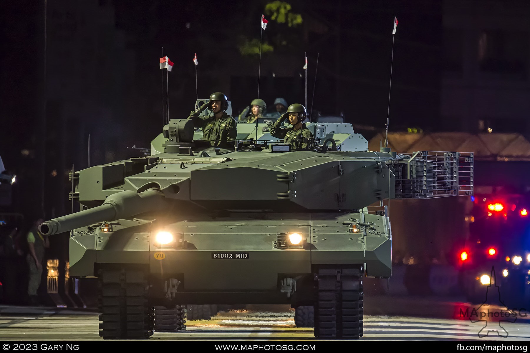 The Leopard 2SG tank salutes the President as it drives past during the Total Defence Parade segment of NDP 2023