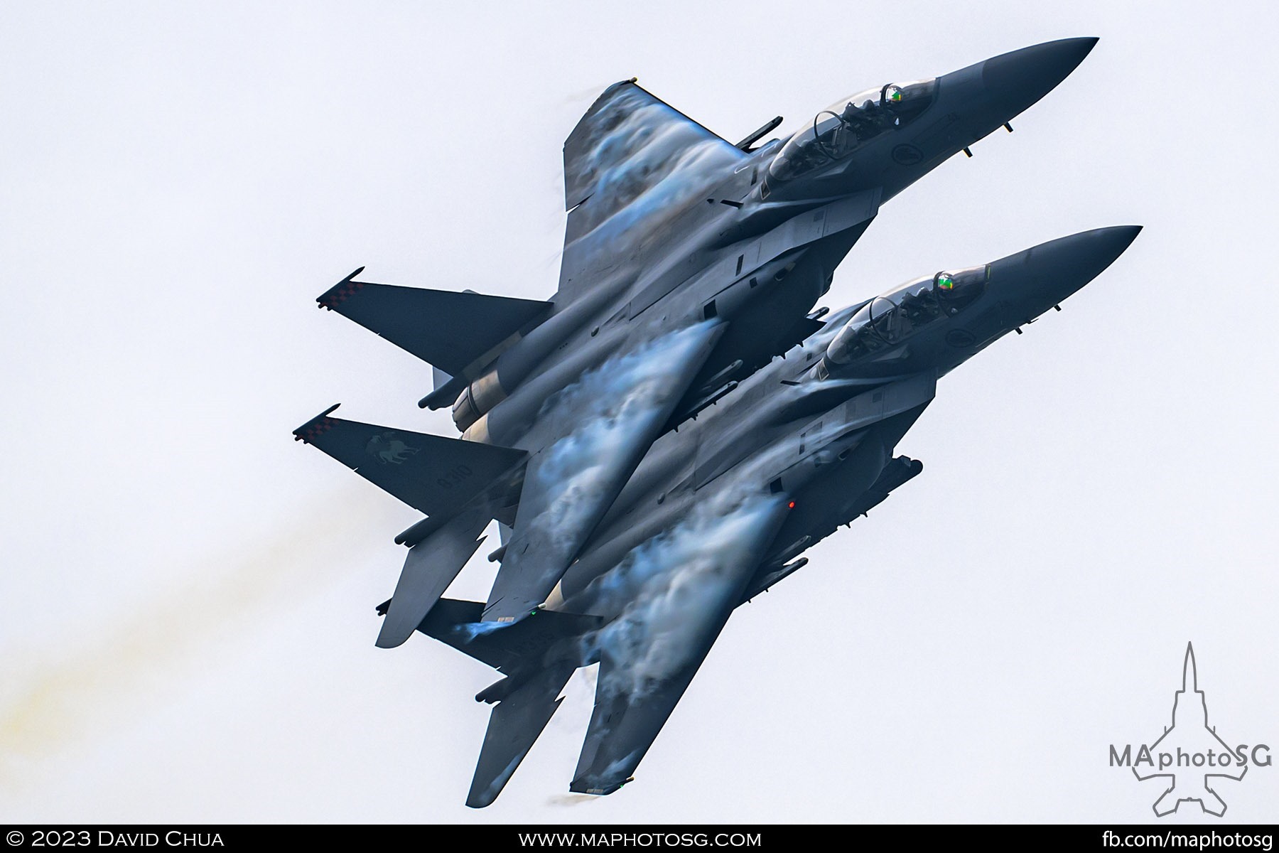 A pair of RSAF F-15SGs performing a close formation high G turn above the Marina Bay.