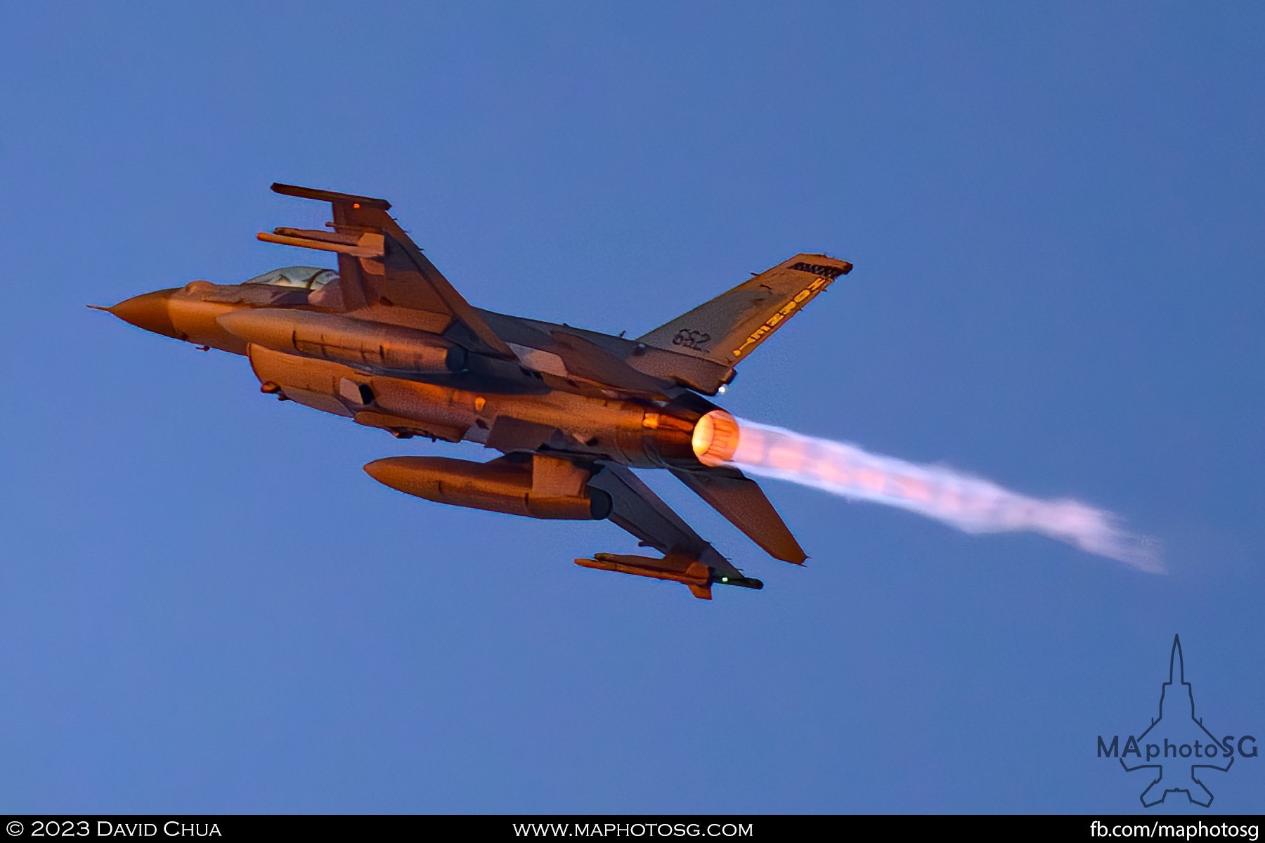 RSAF F-16D+ on afterburners as it performs a vertical climb,