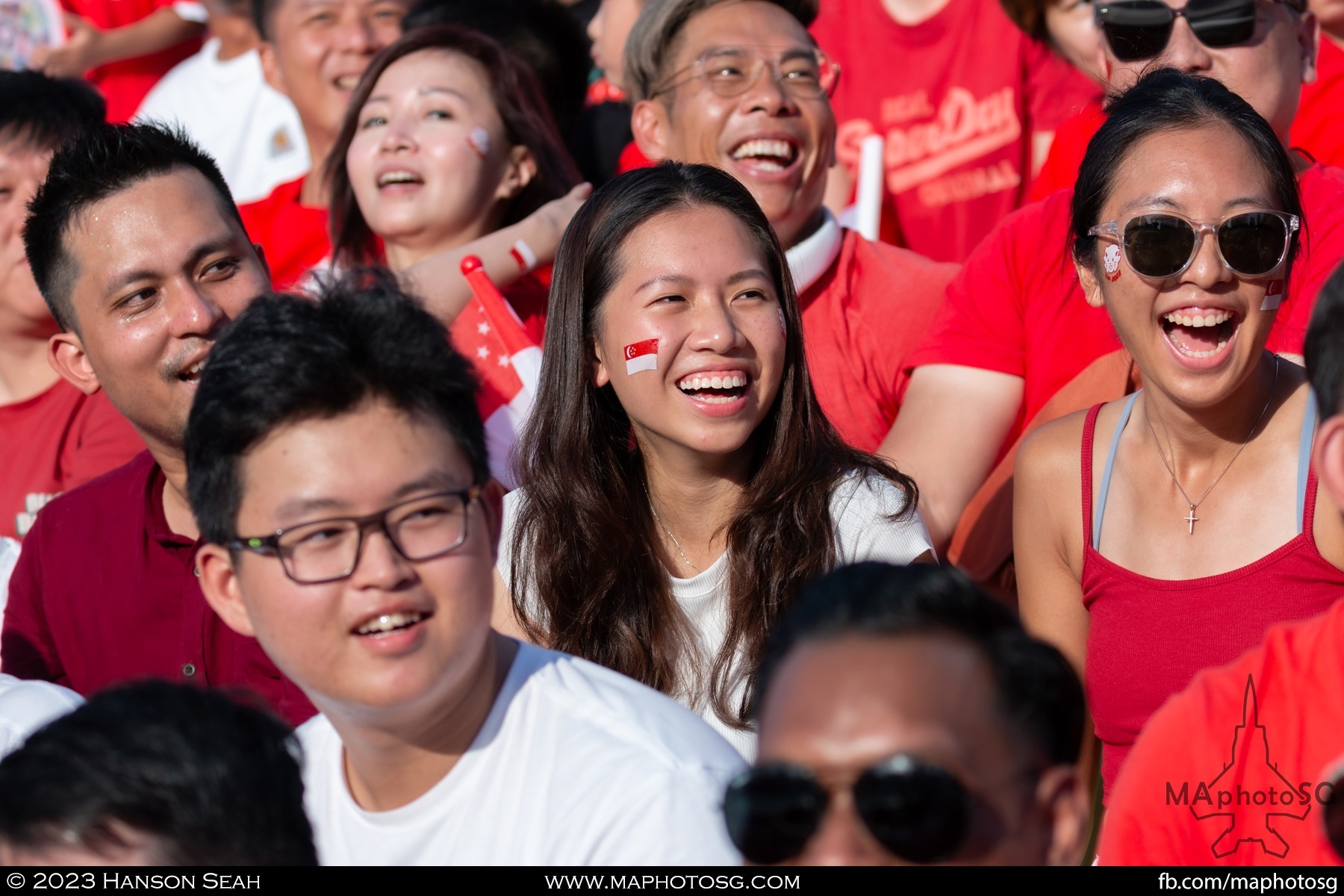 Spectators look on as they wait for their turn to do the Kallang Wave.