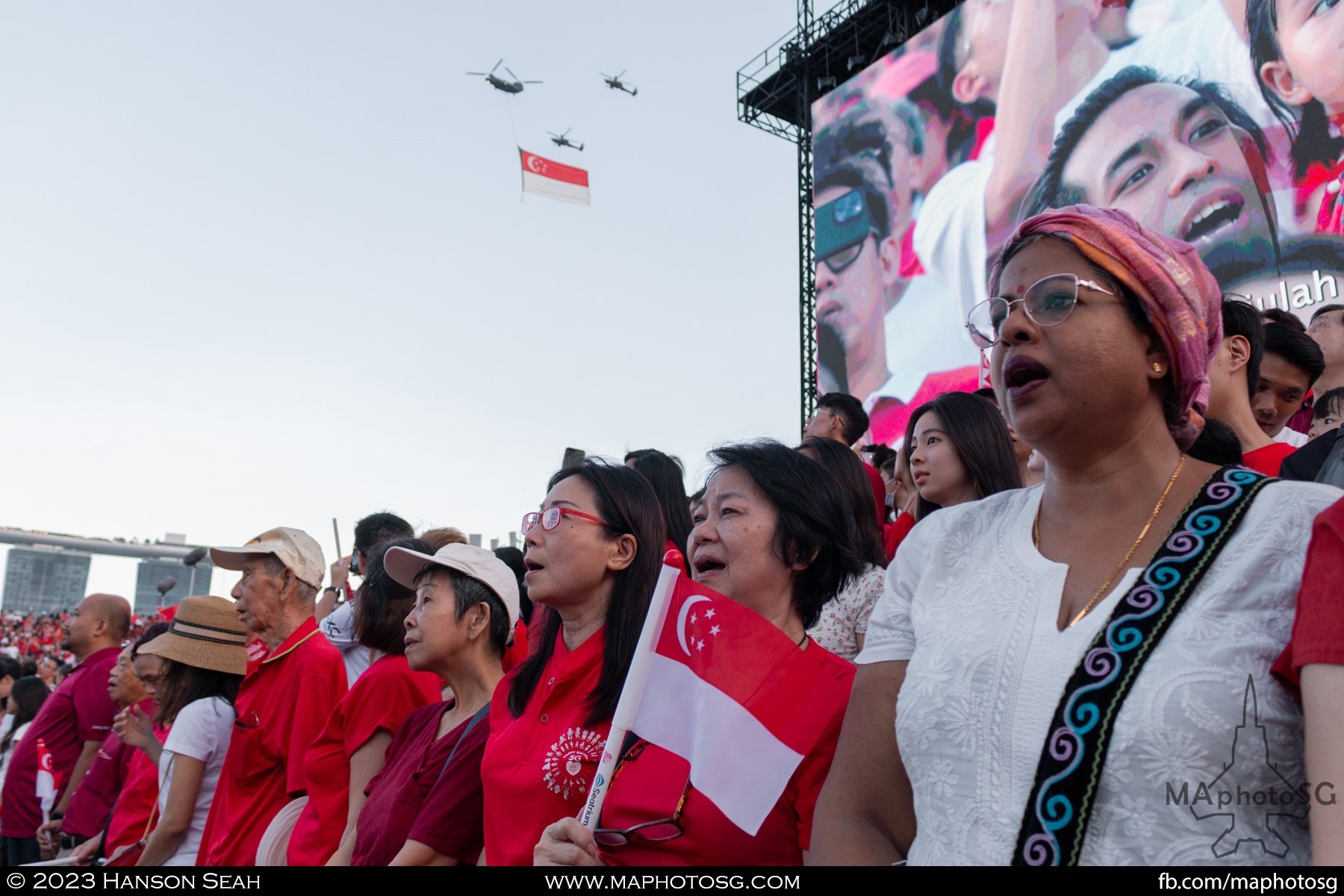 Proudly singing the National Anthem as the state flag flies past Padang show centre.