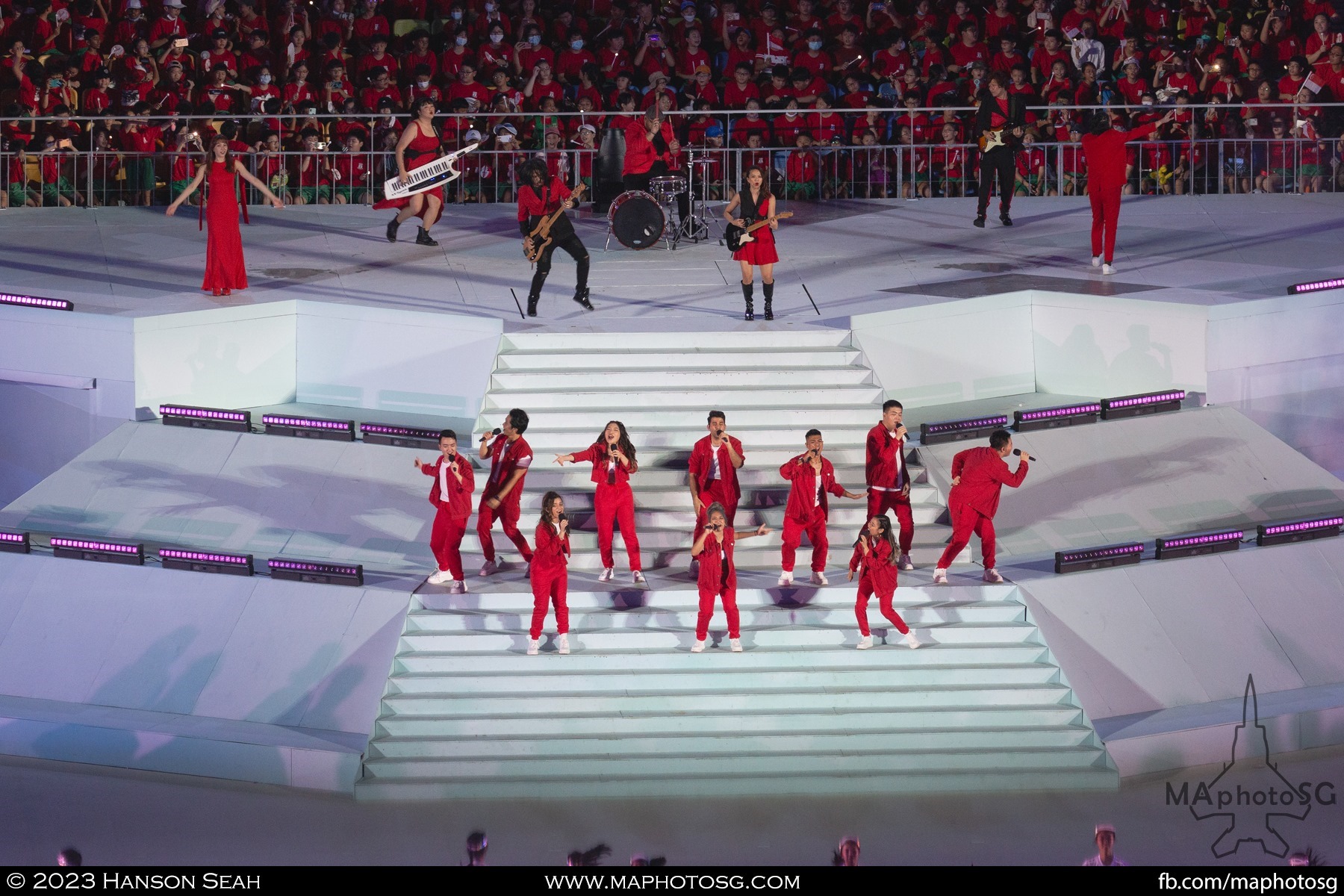 The Island Voices, 53A and Olivia Ong gather on stage to perform the NDP 2023 theme song "Shine Your Light".
