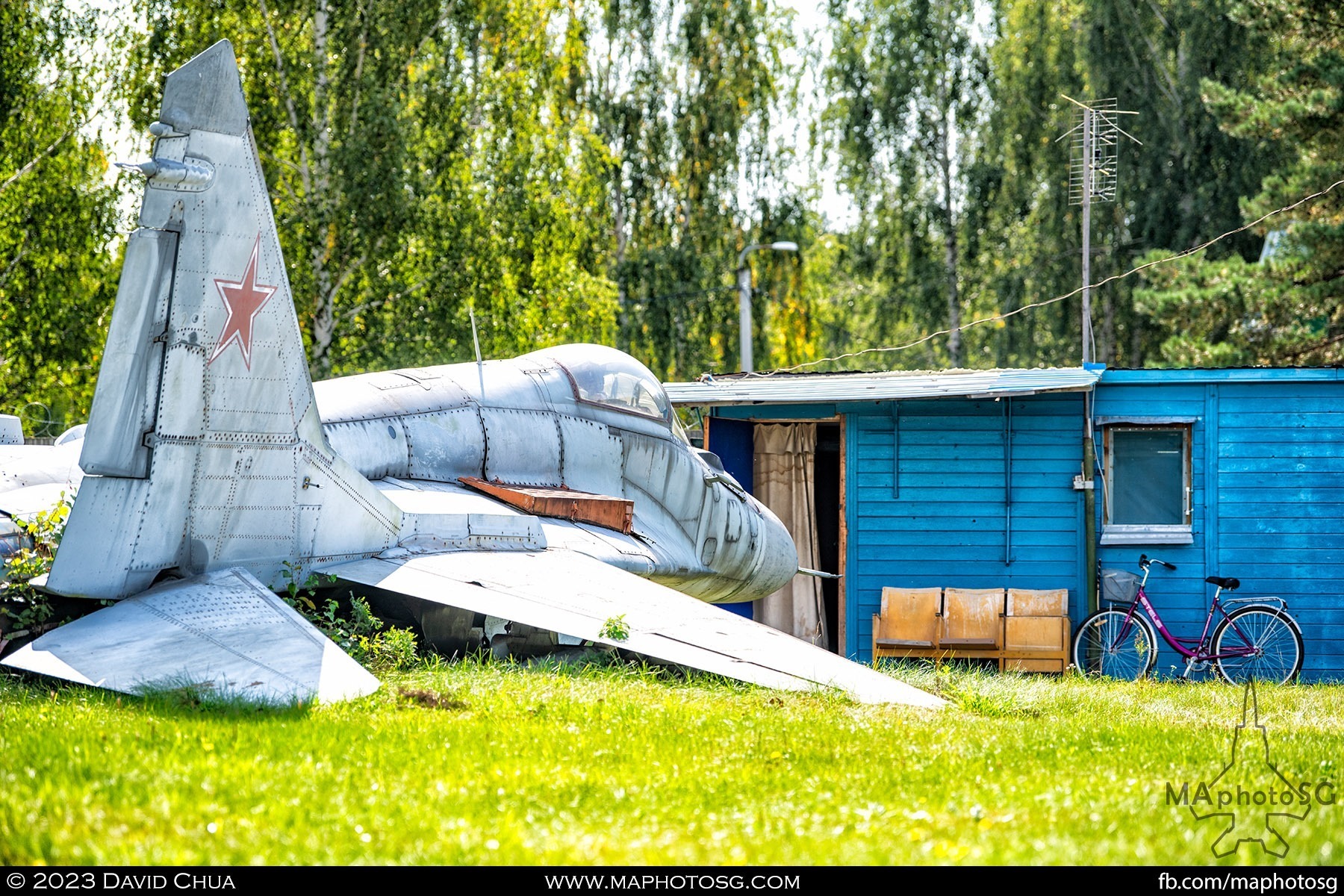 Mikoyan MiG-29 lay without undercarriage in front of a shed